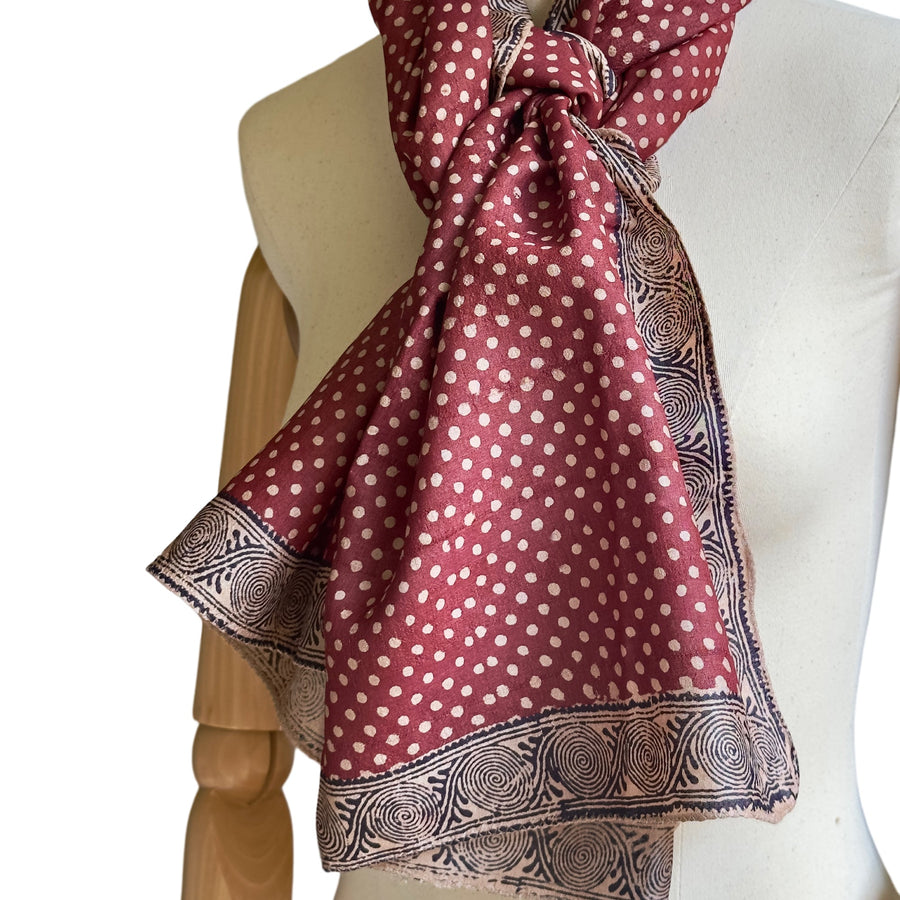 Fyoli Fyoli BINDU Tassar Silk Stole tied in a knot on a dress form mannequin highlighting the Aipan spiral border print.