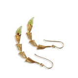 Light green glass variant of the Fyoli Fyoli MIRCHI gold pod chain earrings displayed on textured white background.