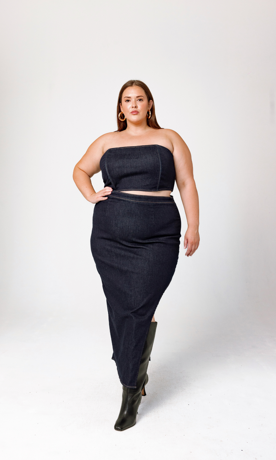 Profile stance showing the structured bodice and silhouette of the GIA/irl Isabella Denim Dress