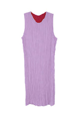 Studio flat lay view of the Baacal Jaya Pleated Dress on the lavender side with the red interior lining visible at the round neck.
