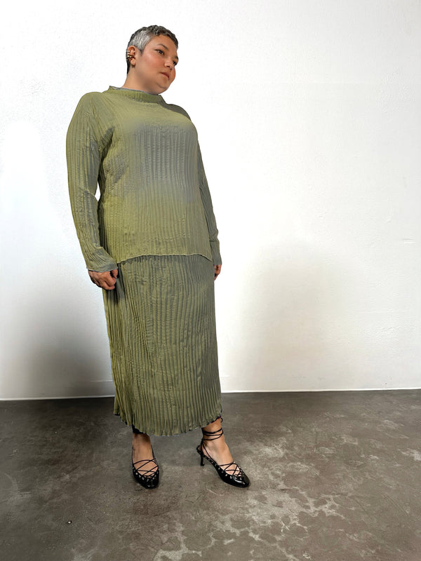 Studio product view of the Baacal Esme Pleated Funnel Neck Top in olive green showing long sleeves and high neckline.