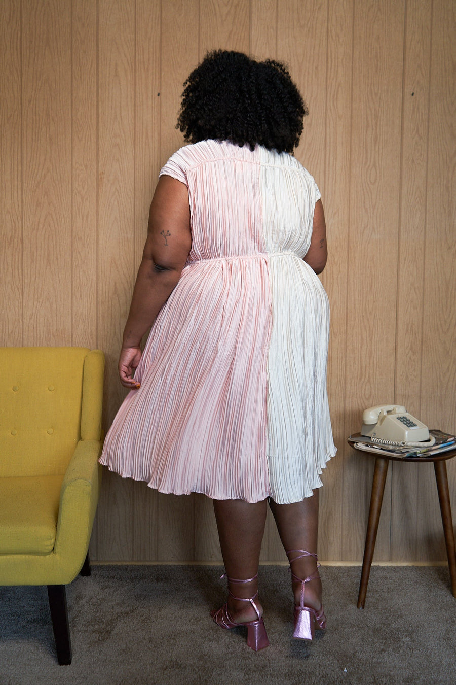 Tamara Malas Penelope Dress Pink and White textured pleated button down full body back view on size inclusive model