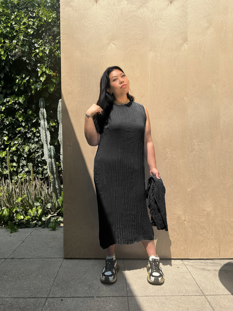 model wearing the pleated dress