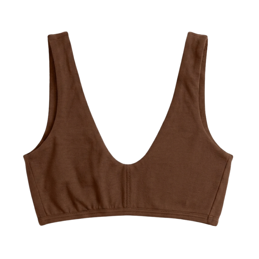 Proclaim Organic Cotton Everyday Bralette in Ella Nude, showcasing the wireless deep scoop neckline design . Flat lay product view.