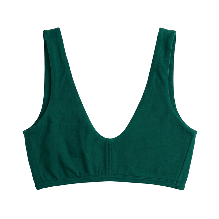 Proclaim Organic Cotton Everyday Bralette in lagoon green, showcasing the wireless deep scoop neckline design . Flat lay product view.