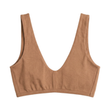 Proclaim Organic Cotton Everyday Bralette in Maya Nude, showcasing the wireless deep scoop neckline design . Flat lay product view.