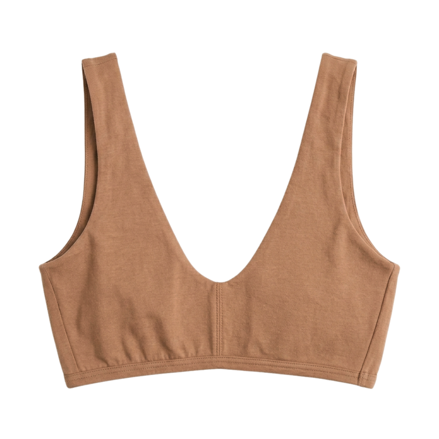 Proclaim Organic Cotton Everyday Bralette in Maya Nude, showcasing the wireless deep scoop neckline design . Flat lay product view.