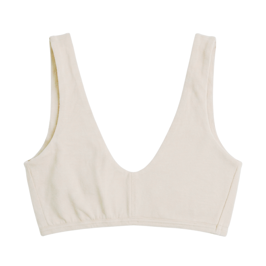 Proclaim Organic Cotton Everyday Bralette in natural, showcasing the wireless deep scoop neckline design.