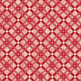 High-resolution close-up fabric swatch view showing the geometric red and cream diamond grid print.