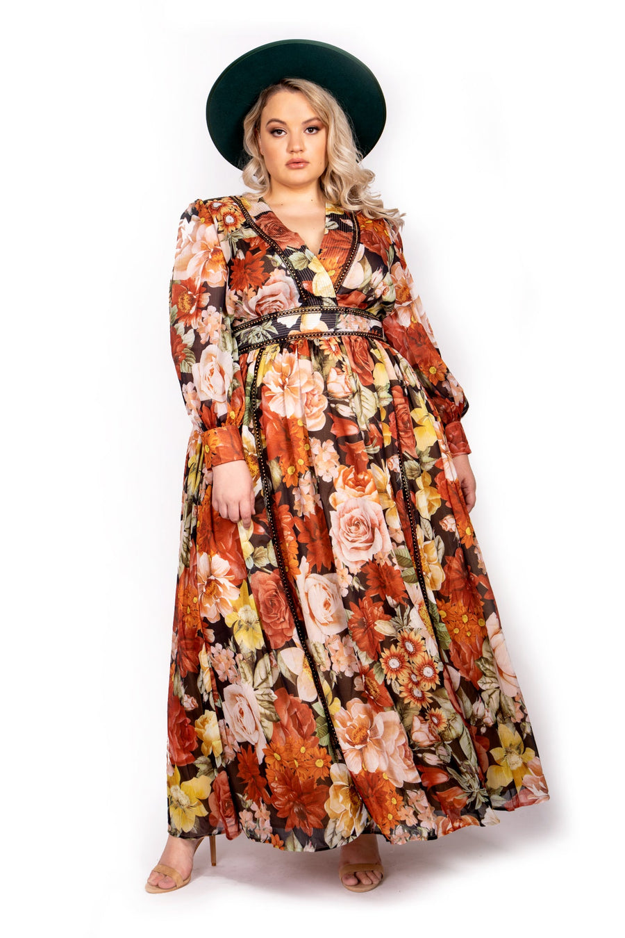 Front view of model Alli wearing the Sante Grace Autumn Queen Chiffon Maxi Dress in fall floral print styled with a green hat.
