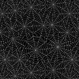 High-resolution print detail of the white spiderweb graphic pattern on a black fabric background.