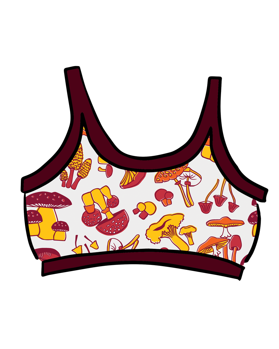 Illustrated flat lay of the Thunderpants USA Longline Bra featuring an allover mushroom print with deep red contrast binding.