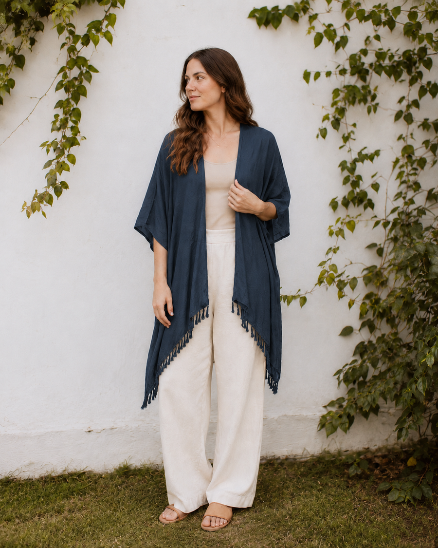 Model wearing the dark charcoal Village Thrive Rayon Kimono styled with wide-leg trousers.
