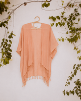 Peach Village Thrive Rayon Kimono hanging on a hanger  