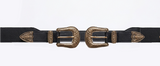 Close-up product shot of the adjustable black western-style belt featuring detailed antique-gold double buckles, matching tip hardware, and an elastic back.