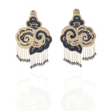 Studio product shot of the CLOUD grey and white glass beaded statement earrings with cascading crystal fringe.