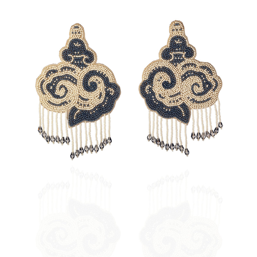 Studio product shot of the CLOUD grey and white glass beaded statement earrings with cascading crystal fringe.